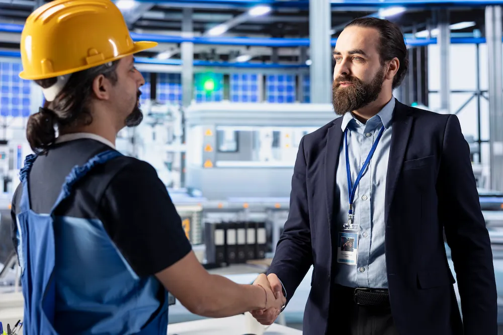 photovoltaics-factory-manager-engineer-shaking-hands-reaching-agreement (1)